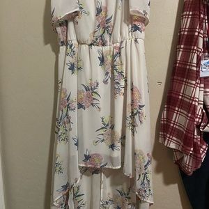 Short dress with a long tail. Spaghetti straps/off the shoulders.
